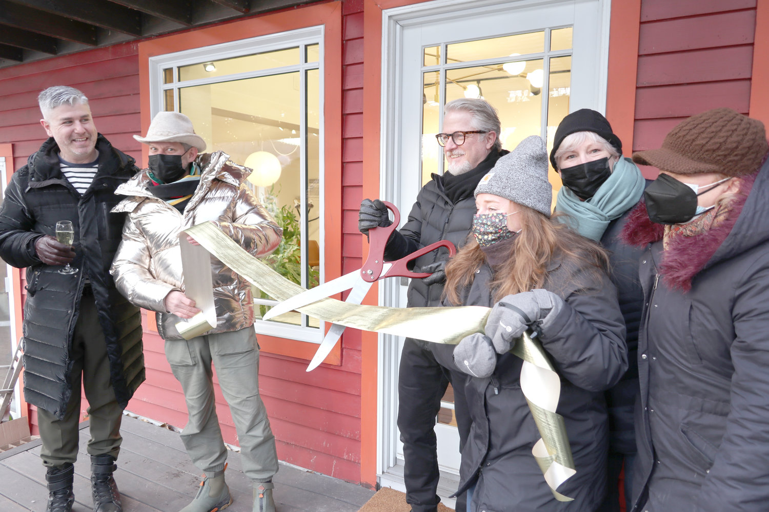 Johnny Pizzolato,  left, Roswell Hamerick, Laura Burrell, Mary Jones-Mellett and Nonna Hall hold the ribbon as Keith Nicholson cuts it and becomes Barryville's latest small-business proprietor on January 15.